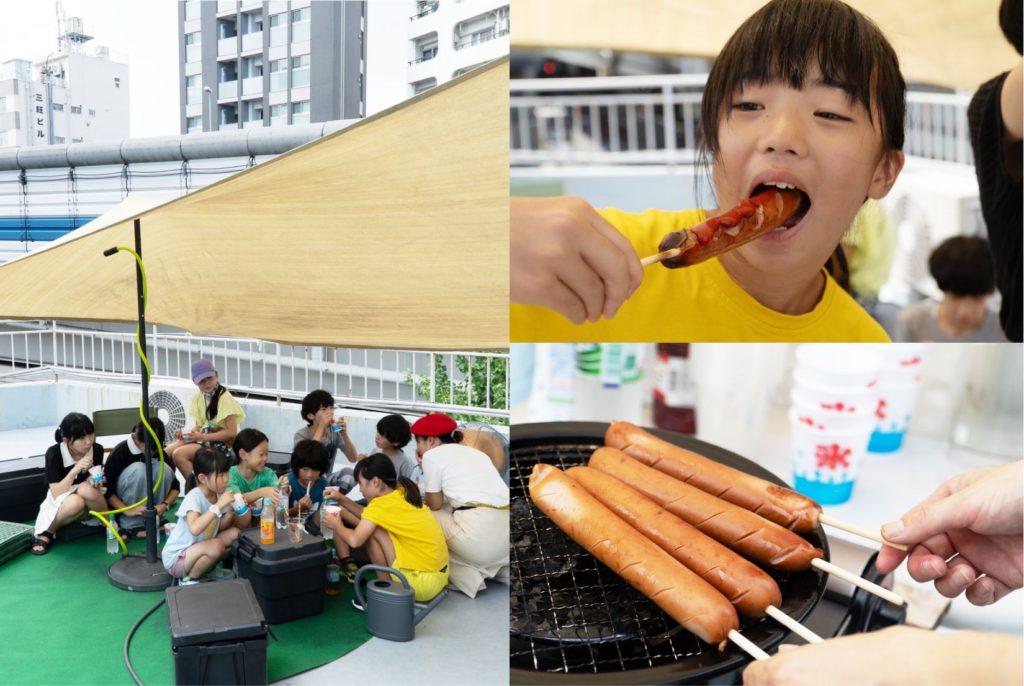 屋上でくつろぐ子どもたちとホットドッグを食べる様子